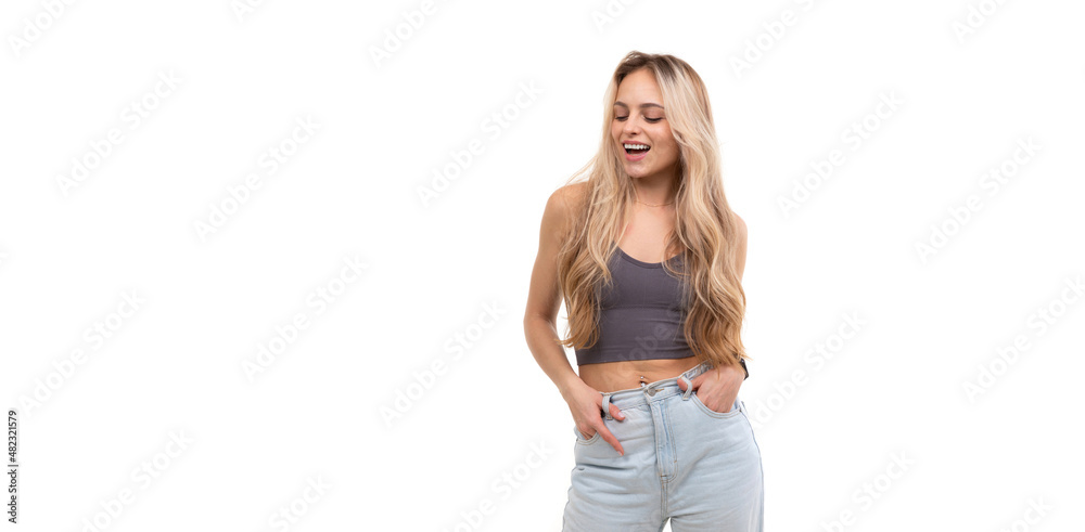 beautiful young woman in gray tank top laughing over isolated background beautiful young woman in gray tank top laughing over isolated background