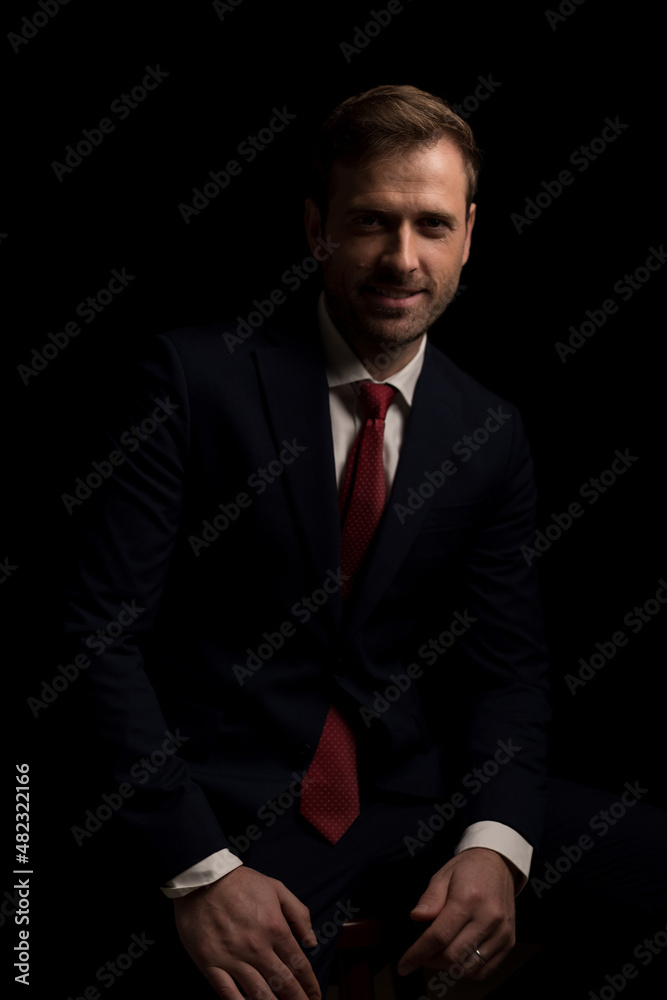 handsome fashion model smiling at the camera