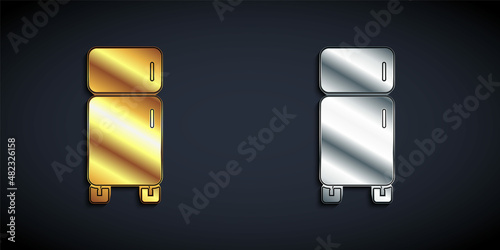 Gold and silver Refrigerator icon isolated on black background. Fridge freezer refrigerator. Household tech and appliances. Long shadow style. Vector