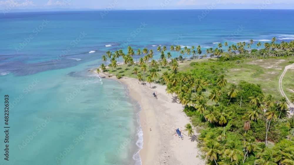 Two helicopters on tropical white beach of Playa Esmeralda, Miches in Dominican Republic. Aerial forward Two helicopters on tropical white beach of Playa Esmeralda, Miches in Dominican Republic. Aerial forward
