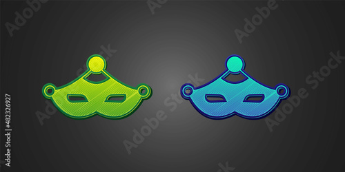 Green and blue Carnival mask icon isolated on black background. Masquerade party mask. Vector