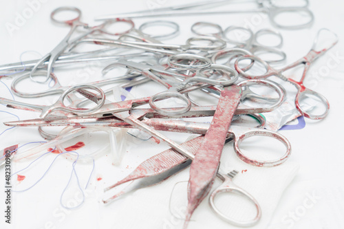 Bloody surgical instruments after surgery photo