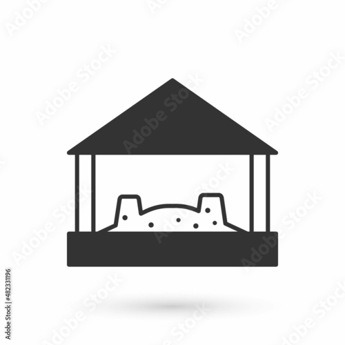 Grey Sandbox for kids with sand and umbrella icon isolated on white background. Vector