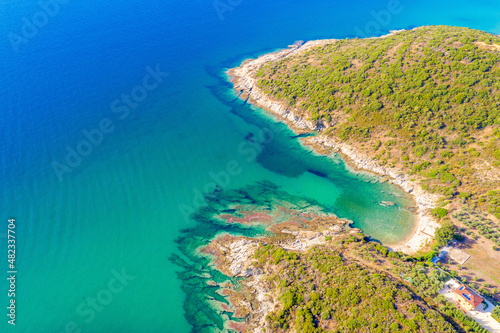 Aerial panorama of summer seascape of Mediterranean sea. Green hills of Peloponnese peninsula, Greece, Europe.