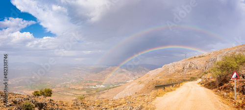 Double rainbow over mountains seen from Mirador Sierra Gorda, Andalucia, Spain, Europe photo