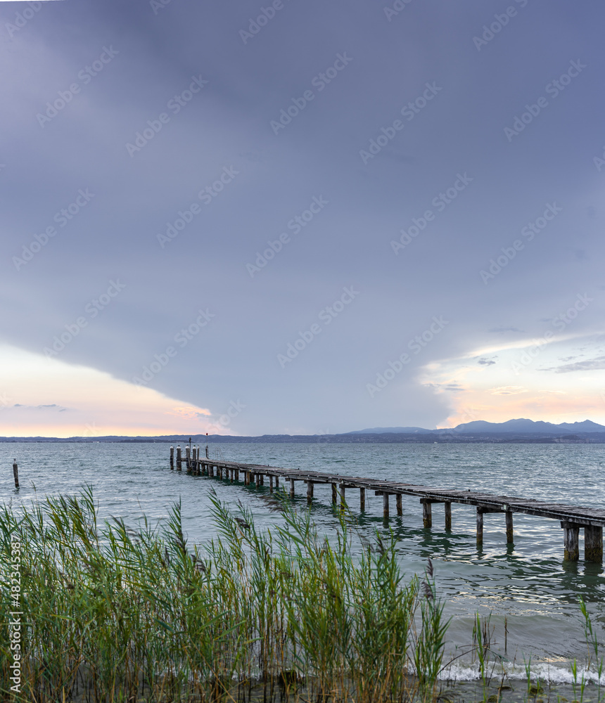 Fototapeta premium Sunset in Lazise on Lake Garda, Italy