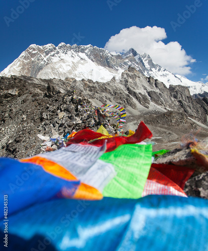 Mount Lhotse peak with prayer flags three passes