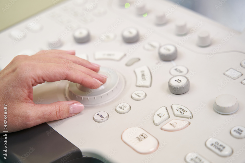 Close up of female hand pressing the button