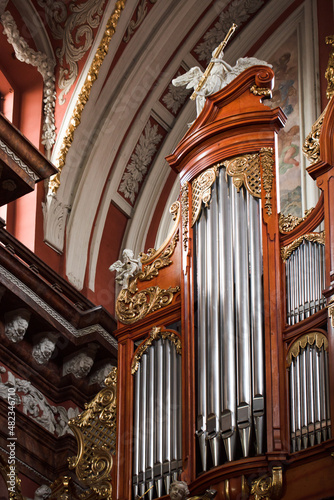 The organ in the Baroque parish church in Poznan, Poland. Fragment of the instrument.