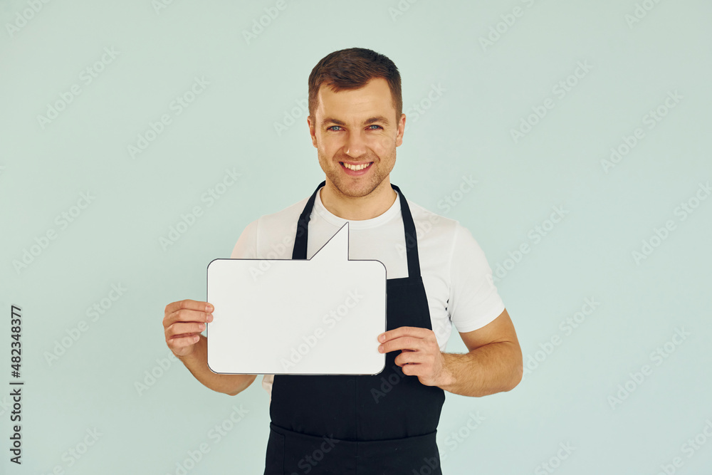 Sincere emotions. Man standing in the studio with empty signs for the text
