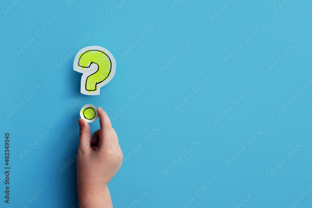 A question mark in the hands of a child. A symbol of children's curiosity
A question mark in the hands of a child. A symbol of children's curiosity