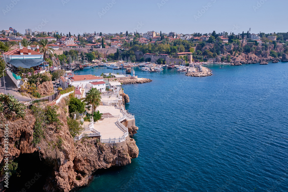 Landscape with sea marina and buildings on cliff. Antalya Turkey.