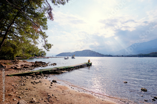 Landscape with Meditterranean sea beach and mountains.