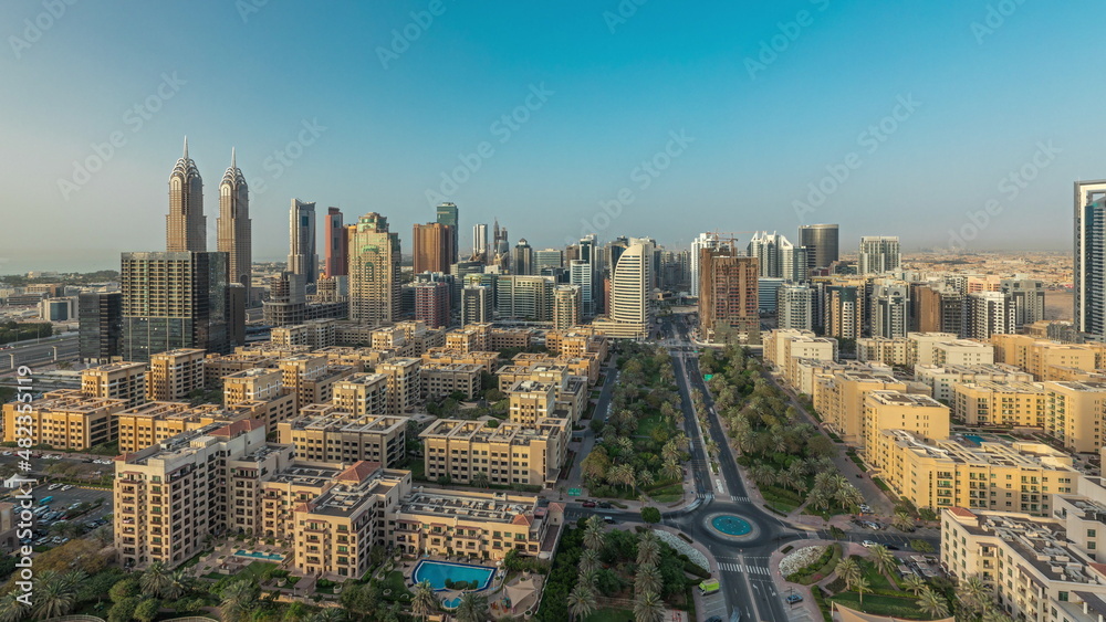 Panorama showing skyscrapers in Barsha Heights district and low rise buildings in Greens district aerial timelapse. Dubai skyline