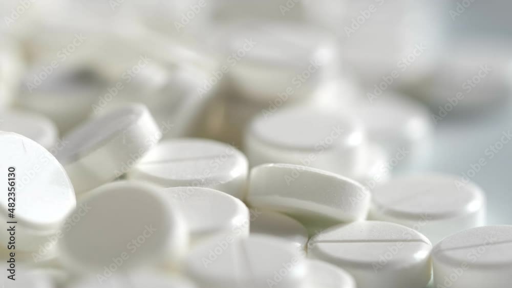 White medical pills rotating closeup. Pills and drugs. Pharmaceutical Industry. The medicine concept. 4K White medical pills rotating closeup. Pills and drugs. Pharmaceutical Industry. The medicine concept. 4K