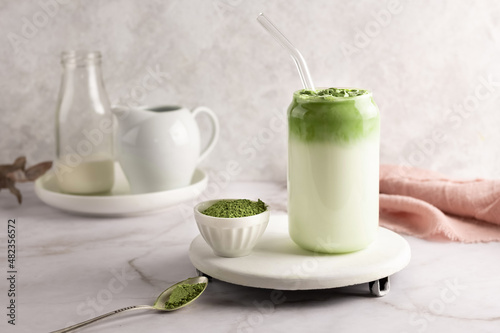 Whipped grean tea with milk, dalgona matcha latte in glass.