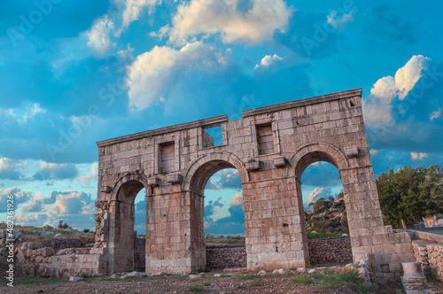 Patara ancient city gate with cloudy sky