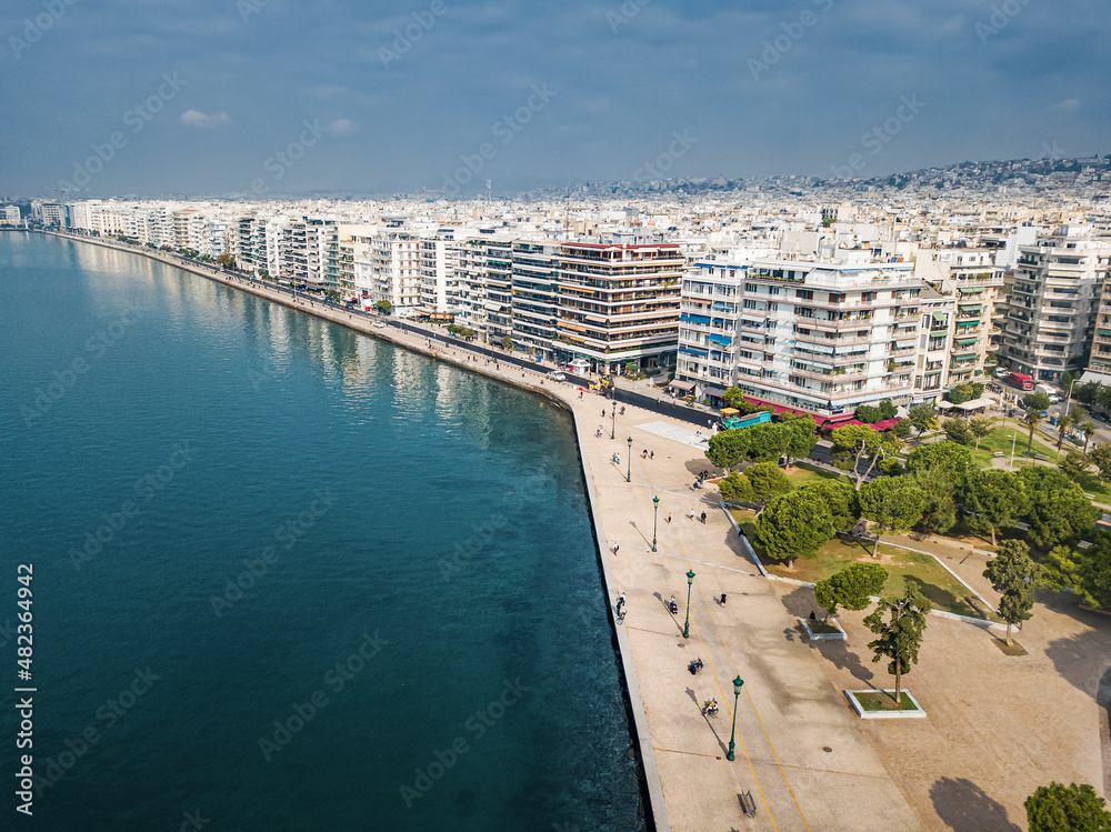 Aerial panorama over the promenade of Thessaloniki city with facades of buildings and a walking pedestrian path along the sea. Visit Greece and sightseeing concept