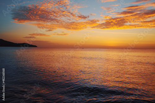 Beautiful seascape with sunset cloudy sky.