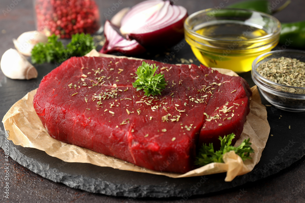 Concept of tasty food with raw beef steak, close up