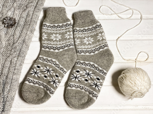 New year flat lay layouts. Knitted socks with a pattern