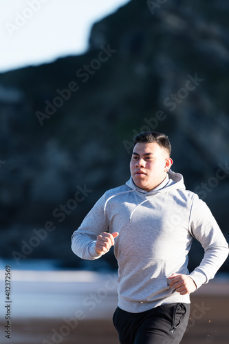 Overweight latin man running