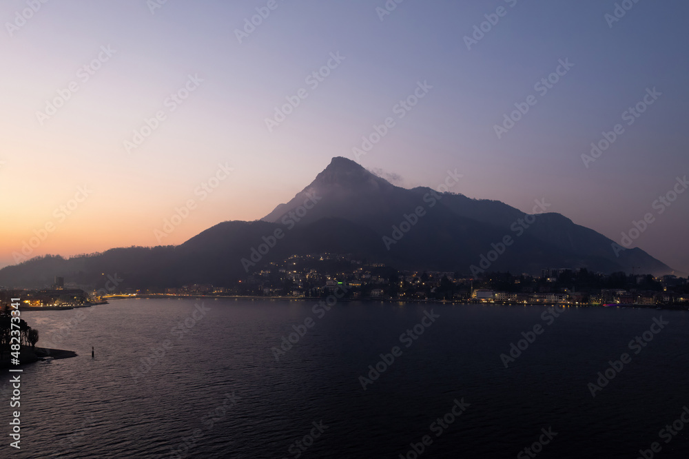 Mount Barro seen from Lecco city at sunrise. Aerial shot.