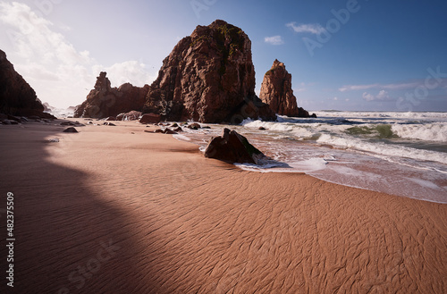 Atlantic ocean beach with cliffs and rocks. Praia da Ursa, Portugal.