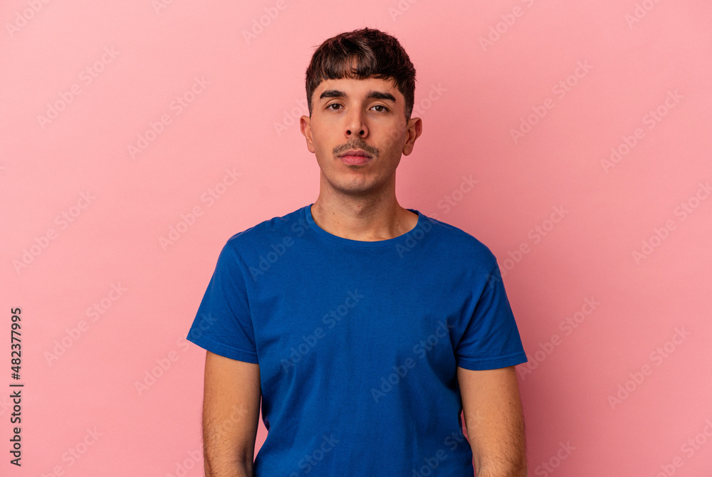 Young mixed race man isolated on pink background sad, serious face, feeling miserable and displeased. Young mixed race man isolated on pink background sad, serious face, feeling miserable and displeased.