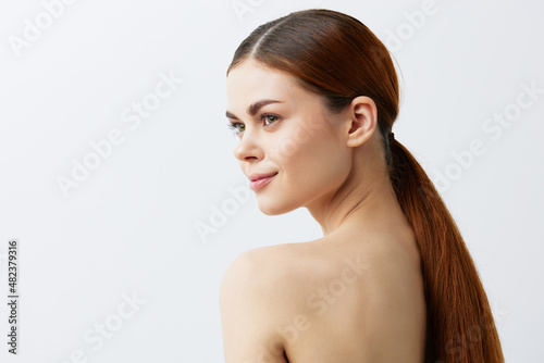 woman bare shoulders pure skin glamor light background