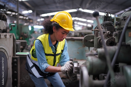 Wallpaper Mural Female apprentice in metal working factory, Portrait of working female industry technical worker or engineer woman working in an industrial manufacturing factory company. Torontodigital.ca