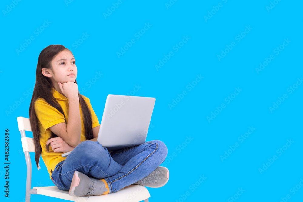 Student girl studying with laptop computer and thinking anout the answer Student girl studying with laptop computer and thinking anout the answer