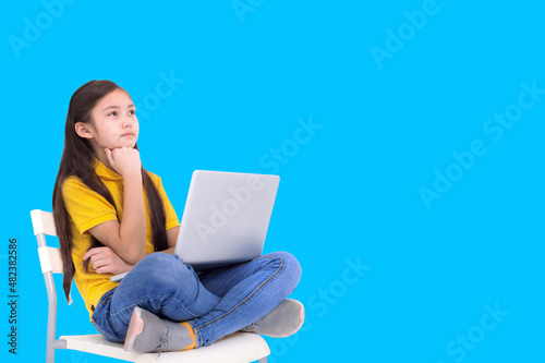 Student girl studying with laptop computer and thinking anout  the answer photo