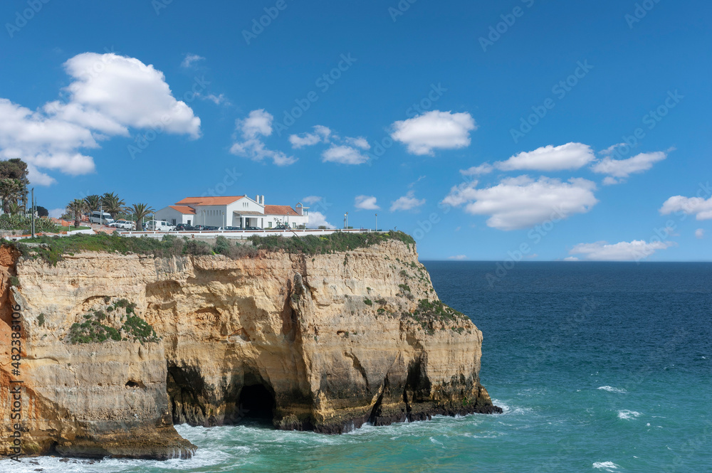 Rocky coast with chapel near Carvoeiro in the Algarve