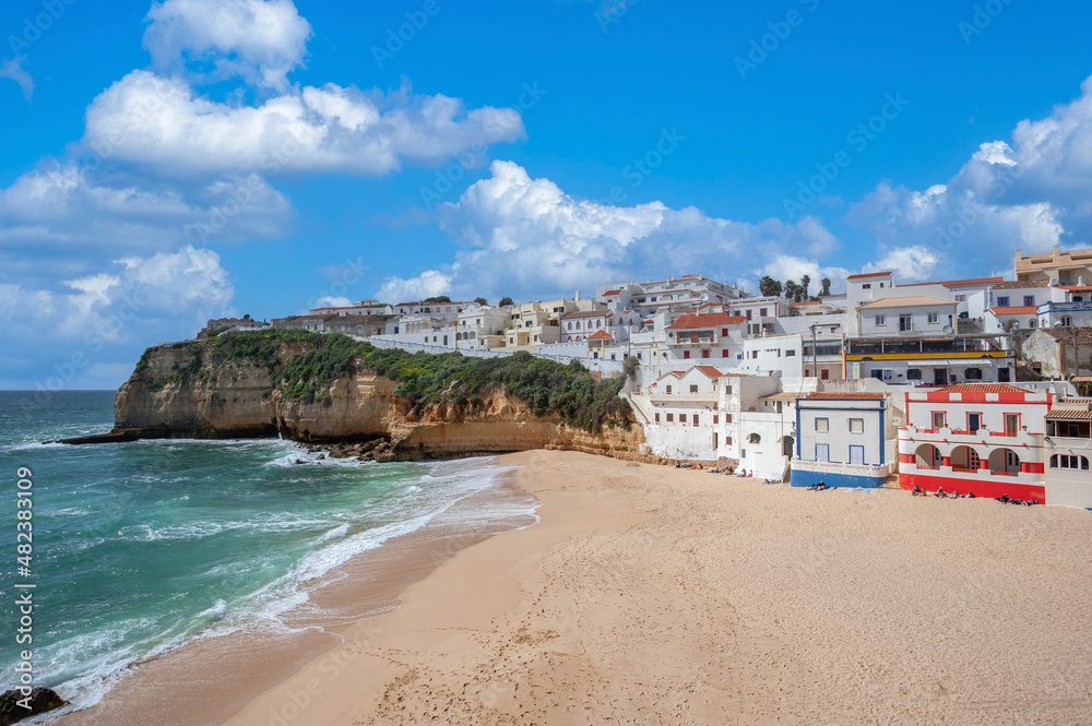Townscape of Carvoeiro in the Algarve with beach and rocky coastline