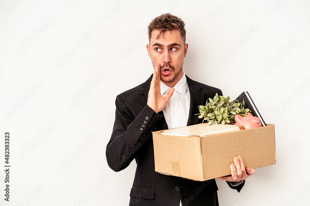 Young caucasian business man fired from job isolated on white background is saying a secret hot braking news and looking aside Young caucasian business man fired from job isolated on white background is saying a secret hot braking news and looking aside