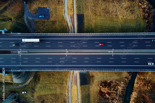 Fotografie Car traffic moving on highway, aerial view
