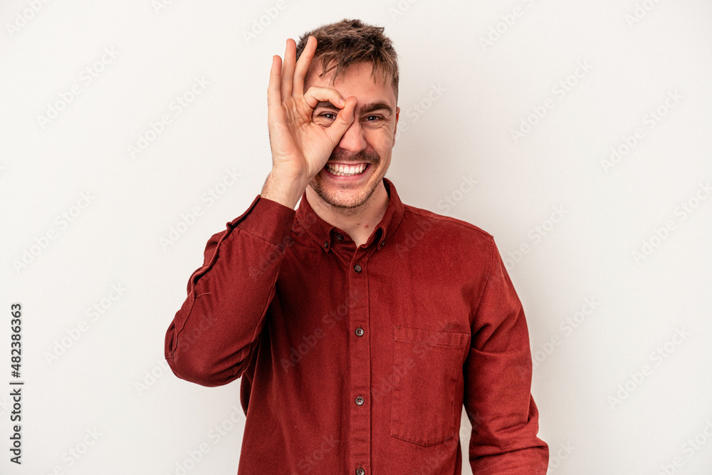 Young caucasian man isolated on white background relaxed thinking about something looking at a copy space. Young caucasian man isolated on white background relaxed thinking about something looking at a copy space.
