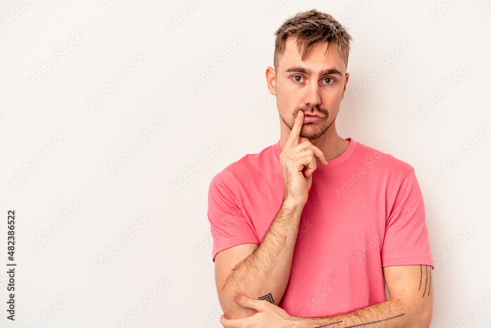 Young caucasian man isolated on white background showing thumb down, disappointment concept. Young caucasian man isolated on white background showing thumb down, disappointment concept.