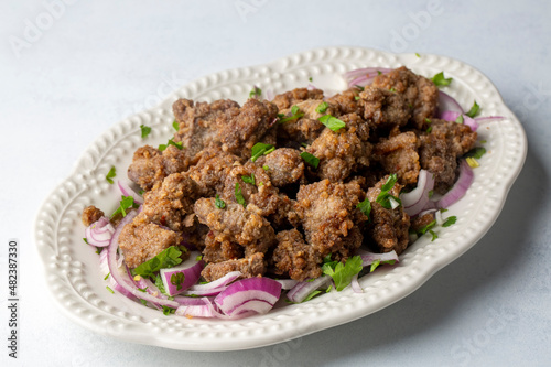 Liver pan (Albanian liver) Turkish traditional food. Liver over rice. (Turkish name; arnavut ciger)