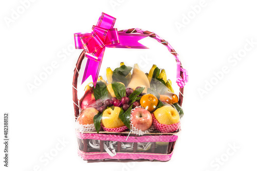 Fresh fruit in the basket on a white background.