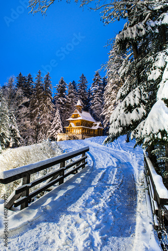 Jaszczurowka Chapel in Zakopane, Highlander Wooden Temple. Snow Forest, Winter Wonderland photo