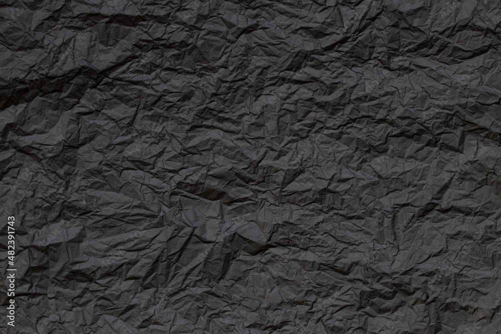 texture of old black colored crumpled grunge paper background texture of old black colored crumpled grunge paper background