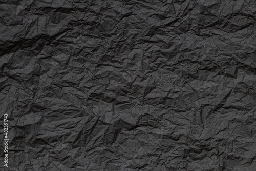 texture of old black colored crumpled grunge paper background