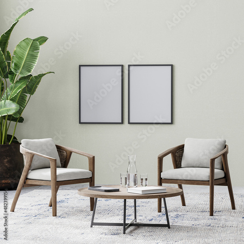 Fototapeta Naklejka Na Ścianę i Meble -  poster frames in room with two chairs and coffee table on rug, tropical plant in pot, empty wall, 3d rendering