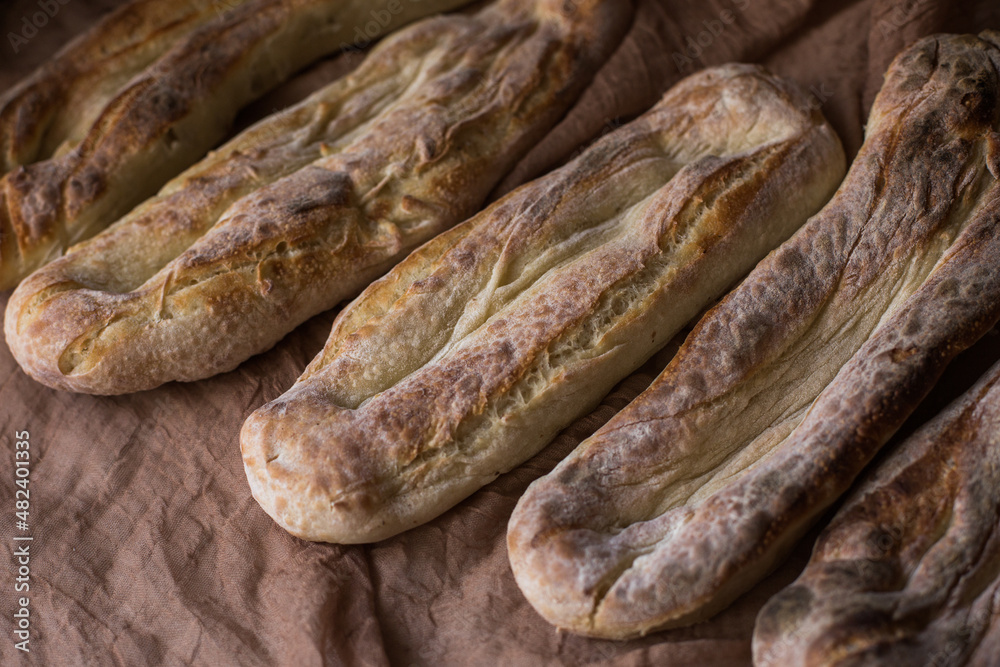 Homemade bread several pieces on a brown background. Home cooking concept. Bakery. Fresh, aromatic, hot bread Homemade bread several pieces on a brown background. Home cooking concept. Bakery. Fresh, aromatic, hot bread