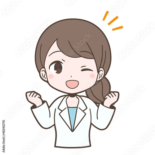 白衣姿でガッツポーズをする若い女性