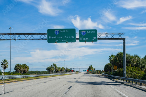Highway road sign Daytona Beach and Miami