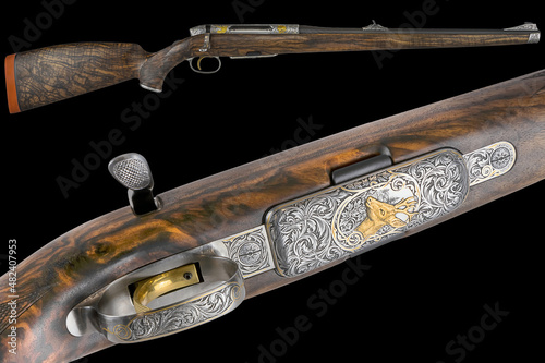 engraved hunting rifle. engraved carabiner. isolate on black background.