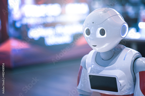 robot android women, Thinking robot, Assistant with Information, Artificial intelligence looks at monitor.